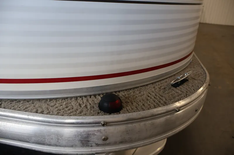 Slide: The Image of 2008 Sun Tracker Fishin' Barge 21 pontoon boat detail with red stripe and cleat. - 41