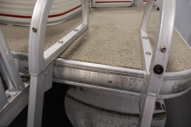 Slide: The Image of 2008 Sun Tracker Fishin' Barge 21 deck with aluminum railing and textured flooring. - 44