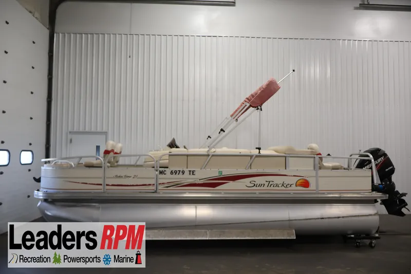 The Image of 2008 Sun Tracker Fishin' Barge 21 pontoon boat in indoor storage. - 0