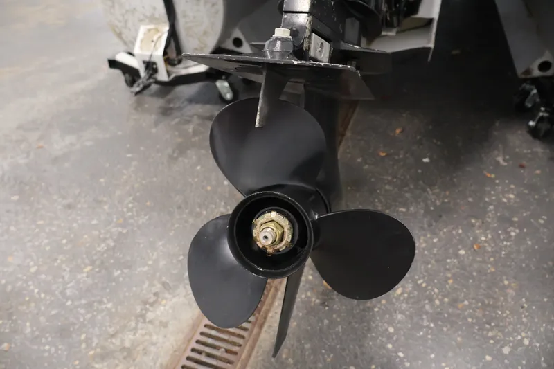 Slide: The Image of Propeller of a 2008 Sun Tracker Fishin' Barge 21 on a workshop floor. - 40