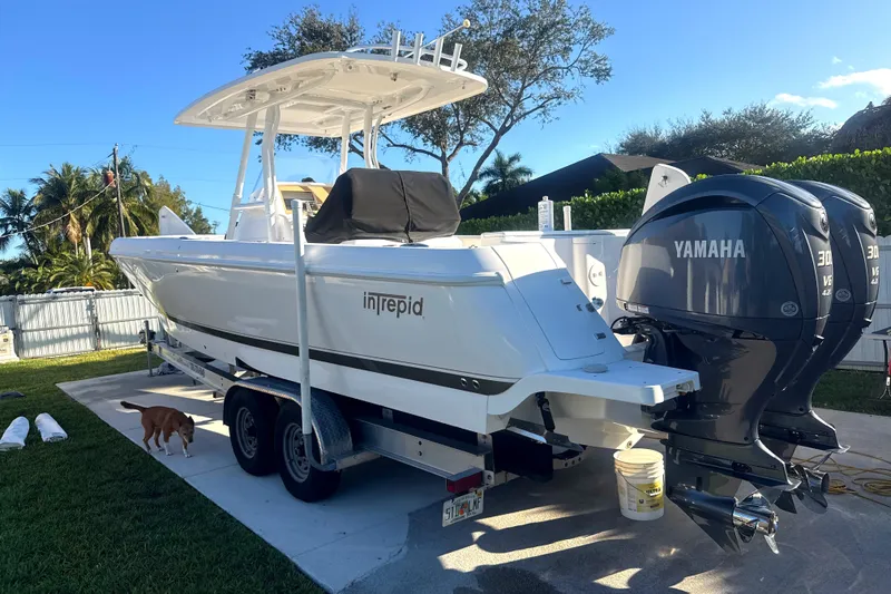 Slide: The Image of 2015 Intrepid 327 Center Console boat with Yamaha engines on a trailer. - 6