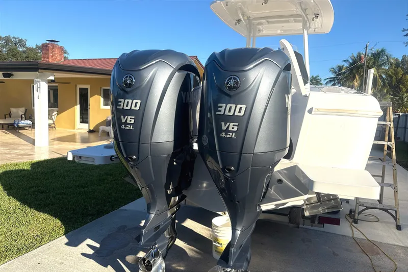 Slide: The Image of 2015 Intrepid 327 Center Console with twin Yamaha 300 V6 outboard engines. - 15
