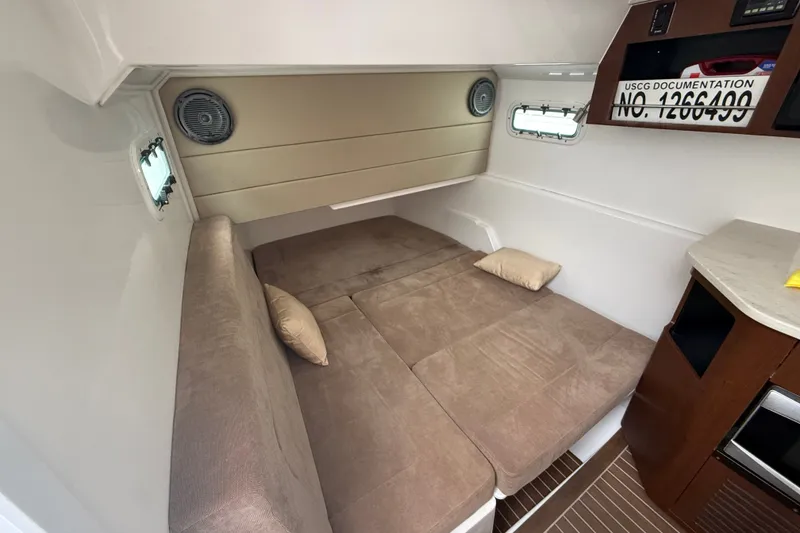 Slide: The Image of Interior cabin of 2016 Everglades 435 Center Console with cozy bed and modern amenities. - 29
