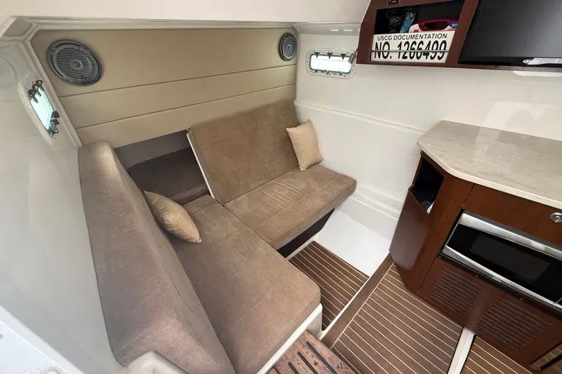 Slide: The Image of Interior of 2016 Everglades 435 Center Console with cozy seating and modern amenities. - 30