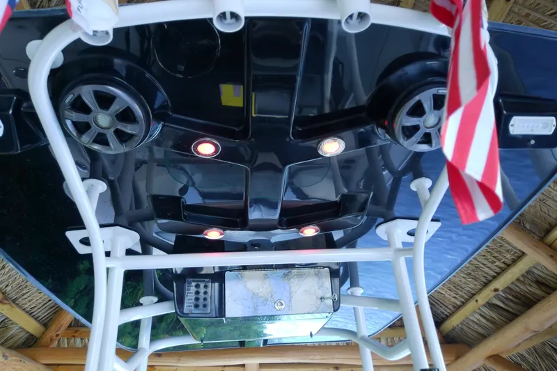 Slide: The Image of 2015 Crevalle 24 Bay boat with speakers and lights under a canopy. - 38