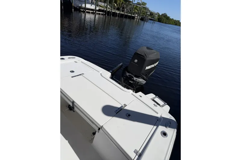 Slide: The Image of 2015 Crevalle 24 Bay boat with Mercury engine on calm water. - 51