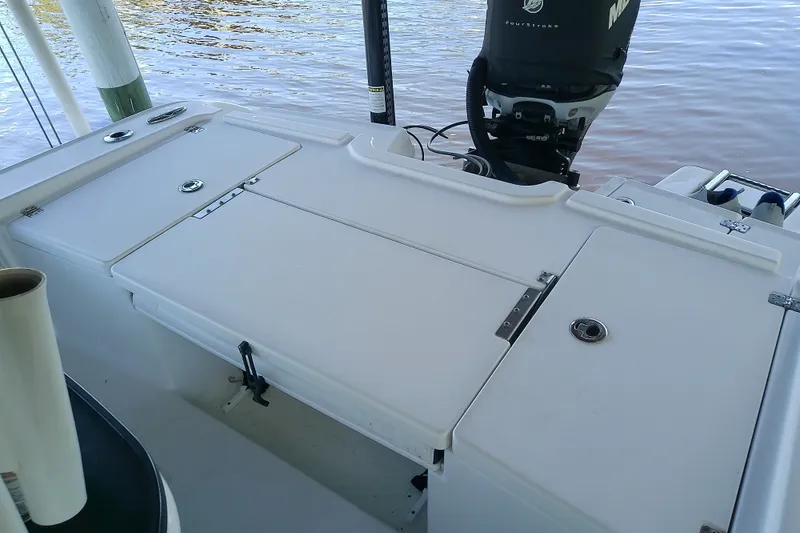 Slide: The Image of 2015 Crevalle 24 Bay boat deck with Mercury outboard motor. - 15