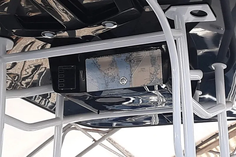 Slide: The Image of 2015 Crevalle 24 Bay boat with mounted navigation equipment and map display. - 25