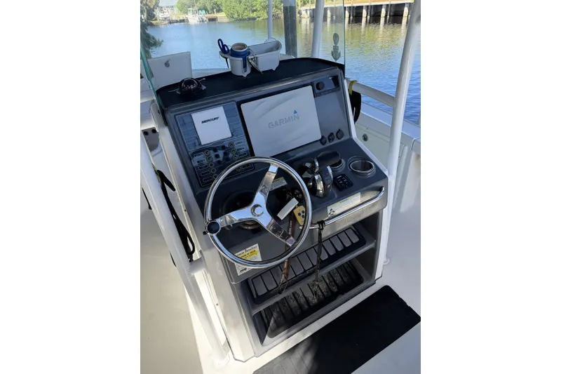 Slide: The Image of Control console of a 2015 Crevalle 24 Bay boat with Garmin navigation system. - 20