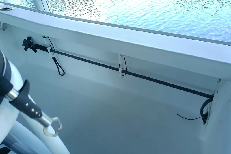 Slide: The Image of Interior view of a 2015 Crevalle 24 Bay boat, showcasing rod holders and clean design. - 35