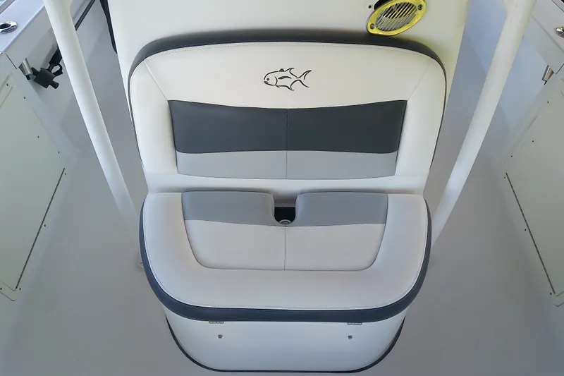 Slide: The Image of White and gray seating on 2015 Crevalle 24 Bay boat with fish logo. - 32