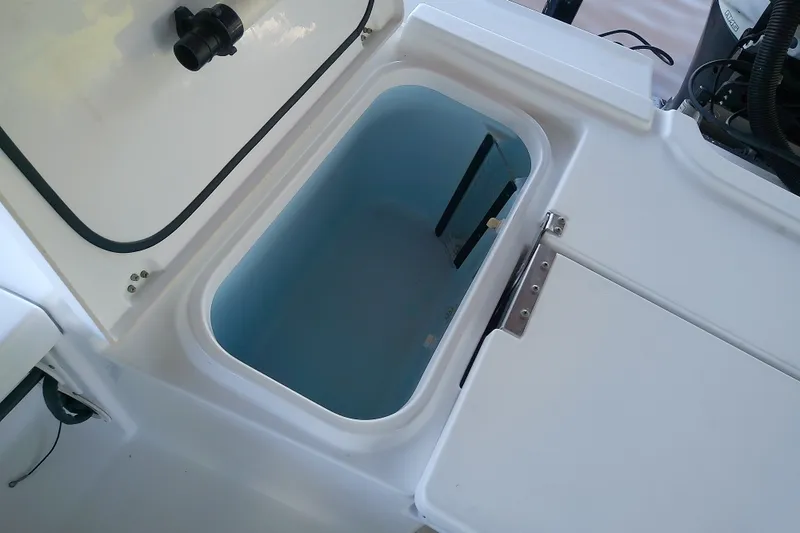 Slide: The Image of Open storage compartment on 2015 Crevalle 24 Bay boat, showcasing interior space. - 18