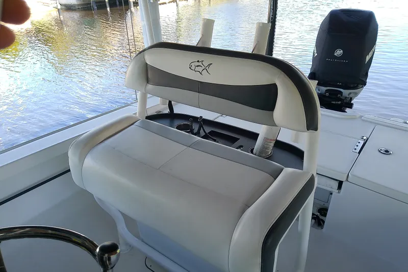 Slide: The Image of Crevalle 24 Bay 2015 boat interior with seating and Mercury outboard motor. - 27