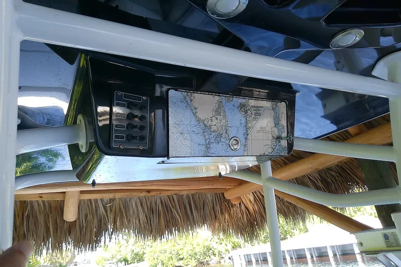 Slide: The Image of Control panel of a 2015 Crevalle 24 Bay boat with nautical map detail. - 26