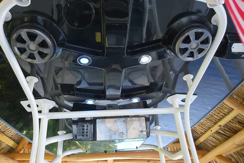 Slide: The Image of Overhead view of 2015 Crevalle 24 Bay boat console with speakers and lights. - 39