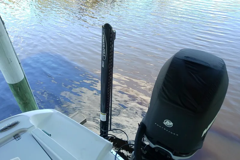 Slide: The Image of 2015 Crevalle 24 Bay boat with Power-Pole anchor and covered outboard motor. - 12