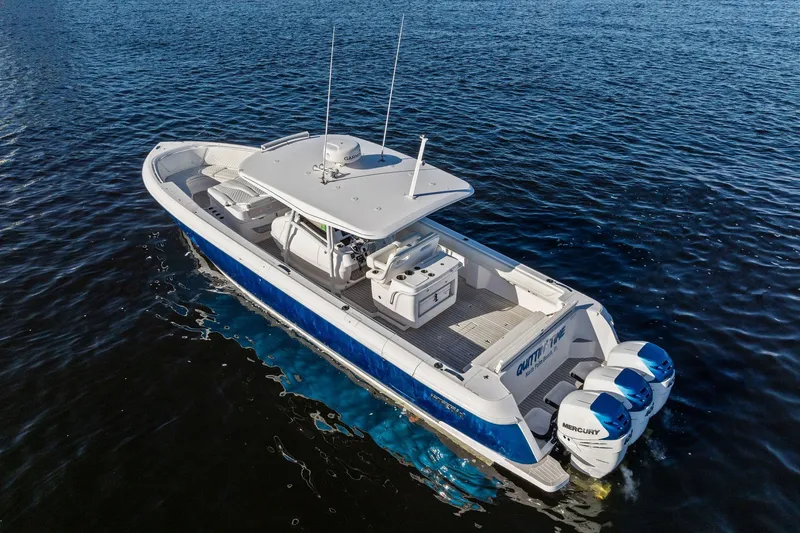Slide: The Image of 2022 Intrepid 407 Nomad FE boat cruising on open water. - 6