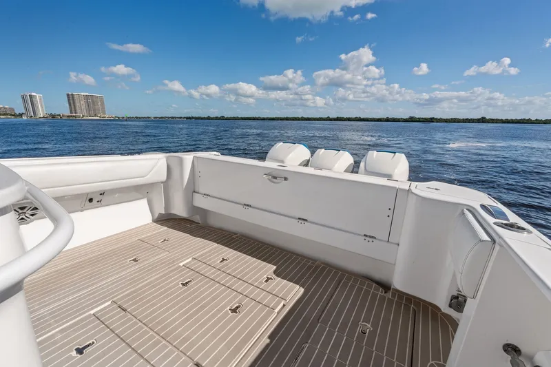 Slide: The Image of 2022 Intrepid 407 Nomad FE boat deck with ocean view and clear sky. - 26