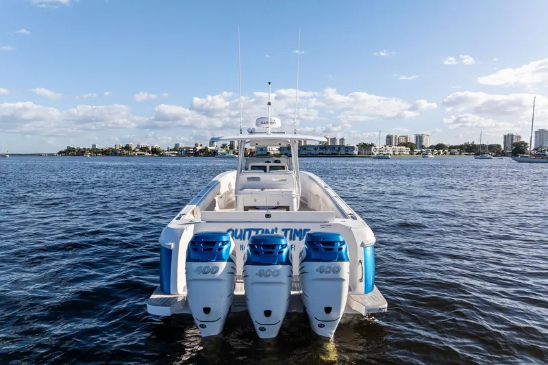 Slide: The Image of 2022 Intrepid 407 Nomad FE boat with triple 400 engines on open water. - 9