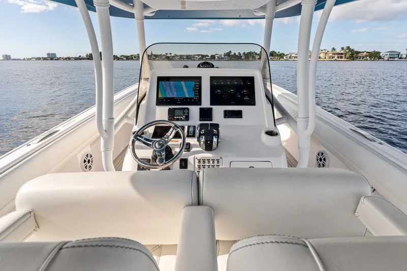 Slide: The Image of Cockpit view of 2022 Intrepid 407 Nomad FE boat with modern navigation system. - 22