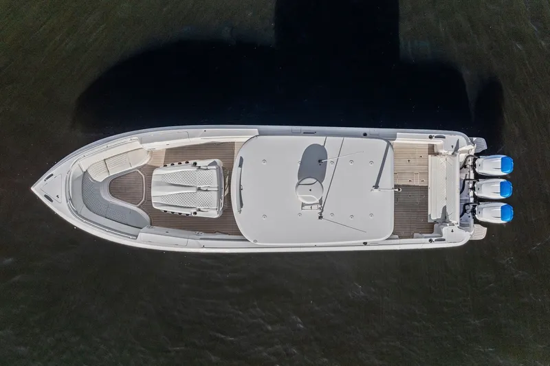 Slide: The Image of Aerial view of 2022 Intrepid 407 Nomad FE boat on water. - 10