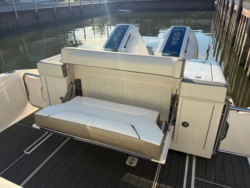 Slide: The Image of The 2025 Tiara Yachts 34 LS features a sleek, modern rear bench seat with dual engines. - 35