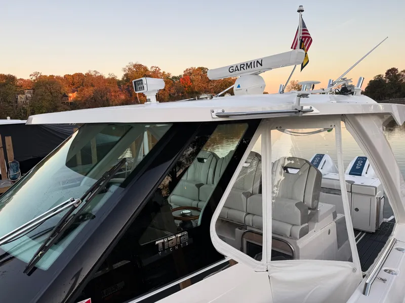 Slide: The Image of The 2025 Tiara Yachts 34 LS features a sleek design with a modern cockpit and Garmin equipment. - 19