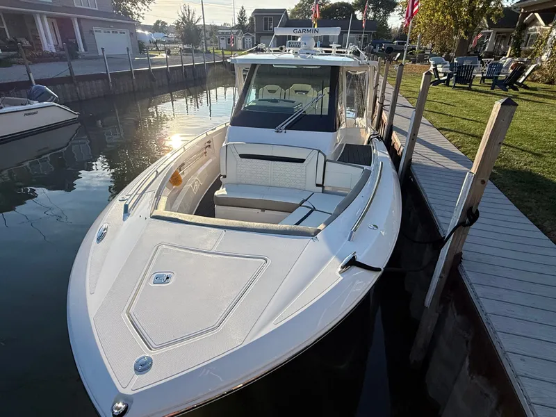 Slide: The Image of The 2025 Tiara Yachts 34 LS is docked, featuring a sleek design and spacious cabin. - 15