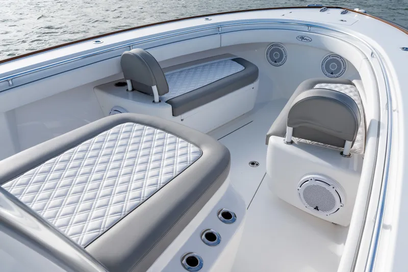 Slide: The Image of Luxurious seating on 2025 Valhalla V-33 boat with quilted upholstery and integrated speakers. - 12
