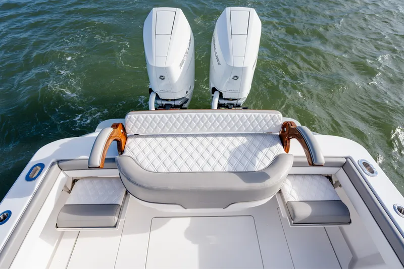Slide: The Image of Luxury seating on 2025 Valhalla V-33 boat with dual Mercury engines. - 32