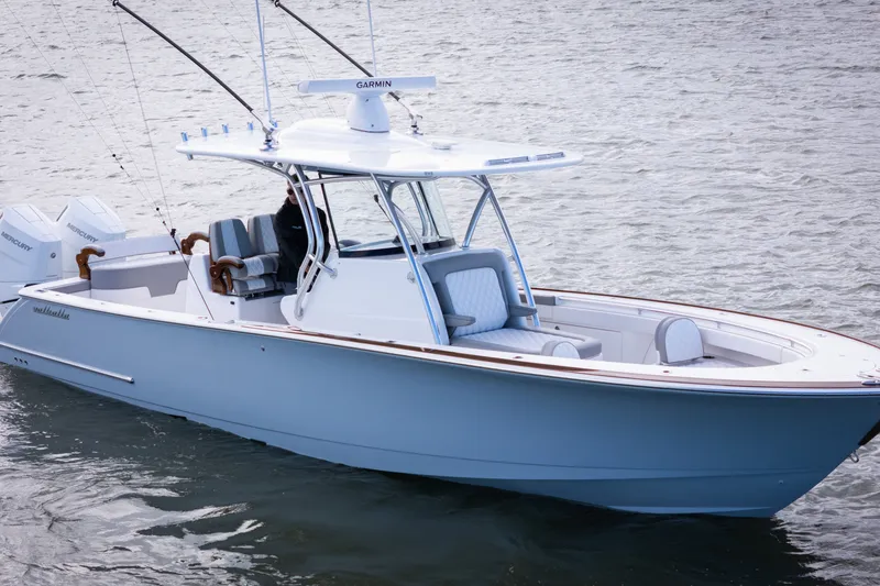 Slide: The Image of 2025 Valhalla V-33 boat on water, featuring sleek design and modern equipment. - 4