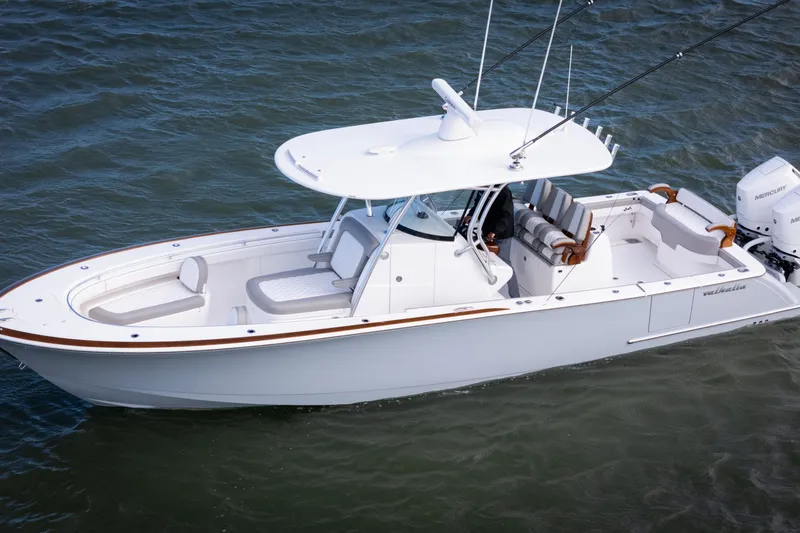 Slide: The Image of 2025 Valhalla V-33 boat cruising on water, featuring sleek design and modern amenities. - 6