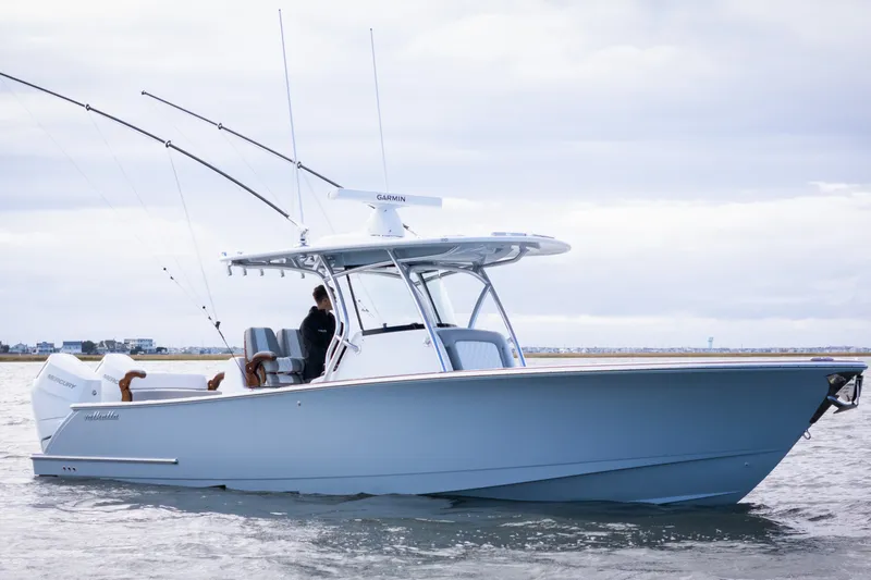 Slide: The Image of 2025 Valhalla V-33 boat on water, featuring sleek design and fishing equipment. - 3