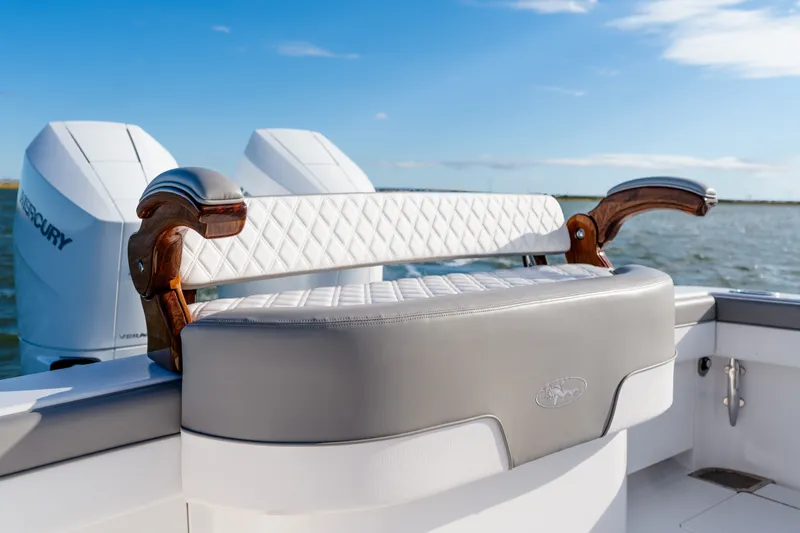 Slide: The Image of Luxury seating on 2025 Valhalla V-33 boat with dual Mercury engines, ocean backdrop. - 29