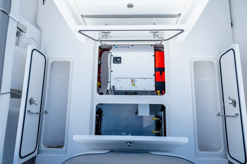 Slide: The Image of Interior view of 2025 Valhalla V-33 boat's engine compartment with open access panels. - 34