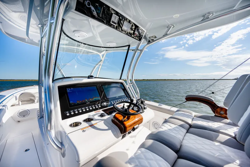 Slide: The Image of Valhalla V-33 2025 boat cockpit with advanced navigation system on open water. - 26