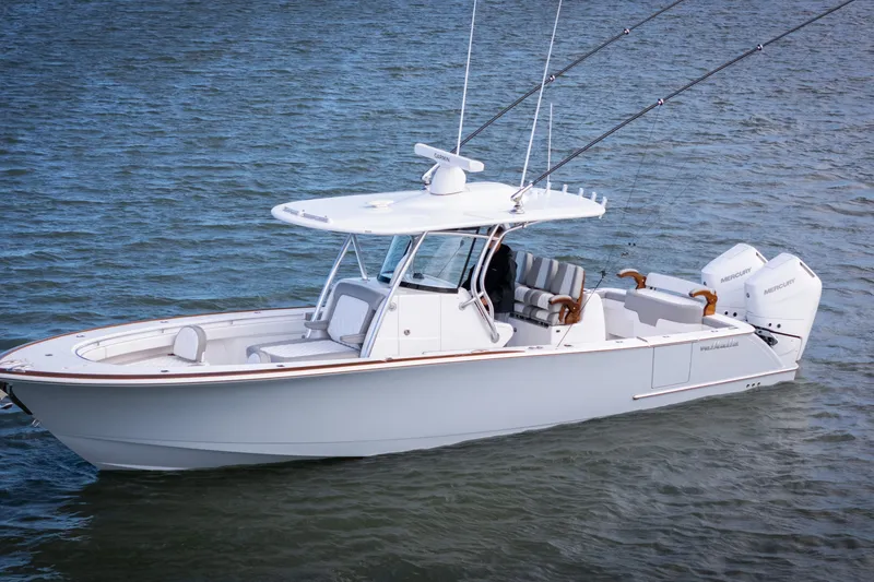 Slide: The Image of 2025 Valhalla V-33 boat on water, featuring sleek design and twin Mercury engines. - 5