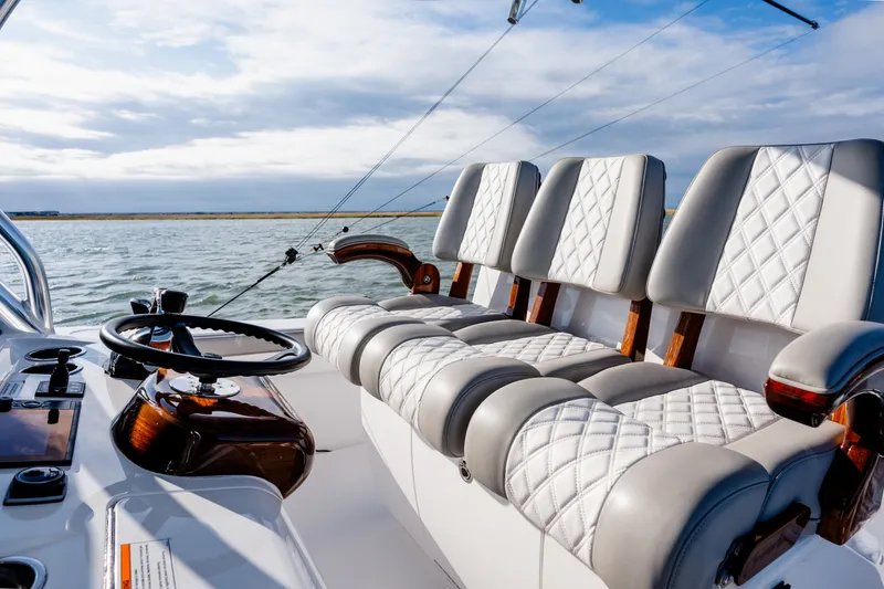 Slide: The Image of Luxurious seating on 2025 Valhalla V-33 boat with quilted upholstery and sleek design. - 21