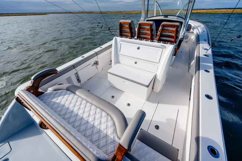 Slide: The Image of Luxurious 2025 Valhalla V-33 boat interior with elegant seating and sleek design on open water. - 33