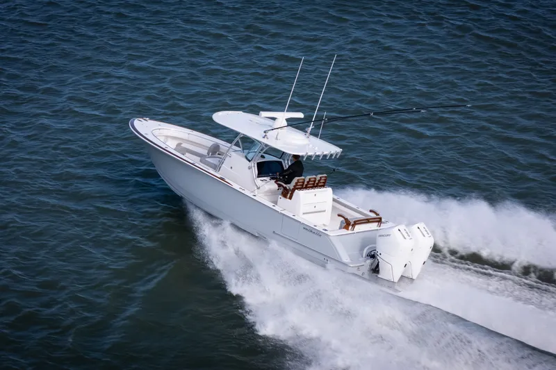 Slide: The Image of 2025 Valhalla V-33 boat cruising on open water, showcasing sleek design and powerful engines. - 10