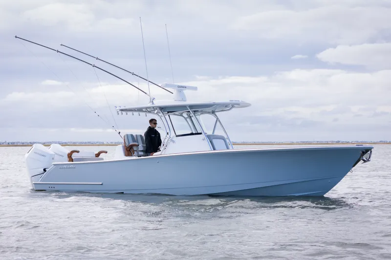 The Image of 2025 Valhalla V-33 boat on water, featuring sleek design and fishing rods. - 1