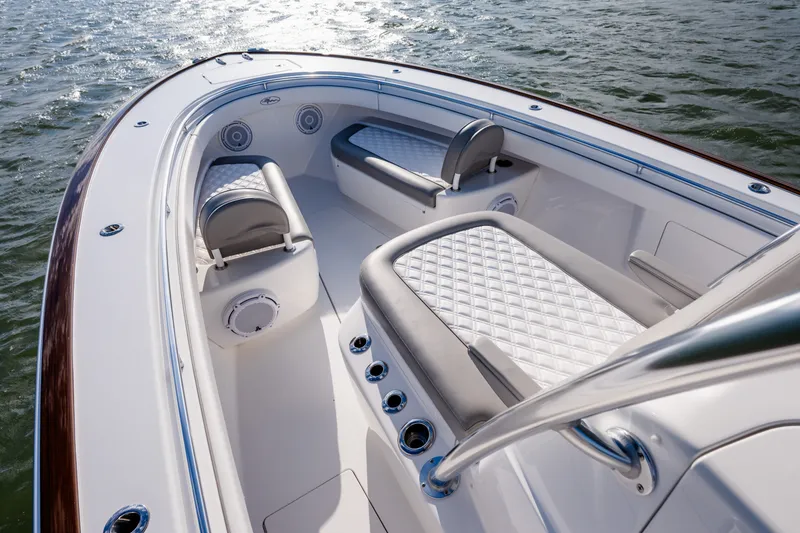 Slide: The Image of Luxurious 2025 Valhalla V-33 boat interior with cushioned seating on open water. - 24