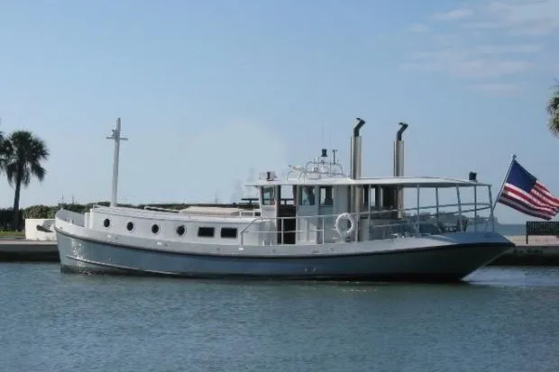 The Image of Custom Thomas 50 Dutch Barge, 2010, cruising on a calm waterway with an American flag. - 0