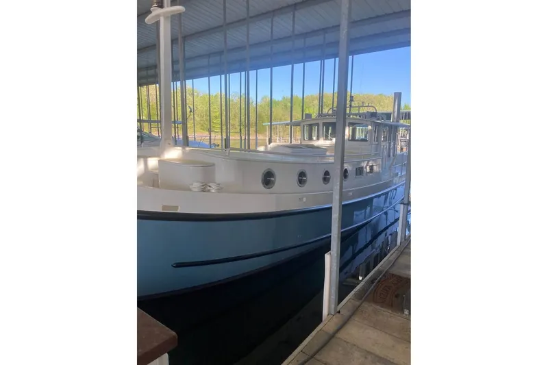 Slide: The Image of Custom Thomas 50 Dutch Barge, 2009, docked in a covered marina. - 2
