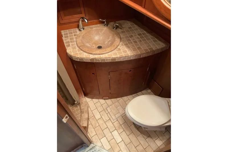 Slide: The Image of Bathroom interior of 2009 Custom Thomas 50 Dutch Barge with tiled sink and toilet. - 5