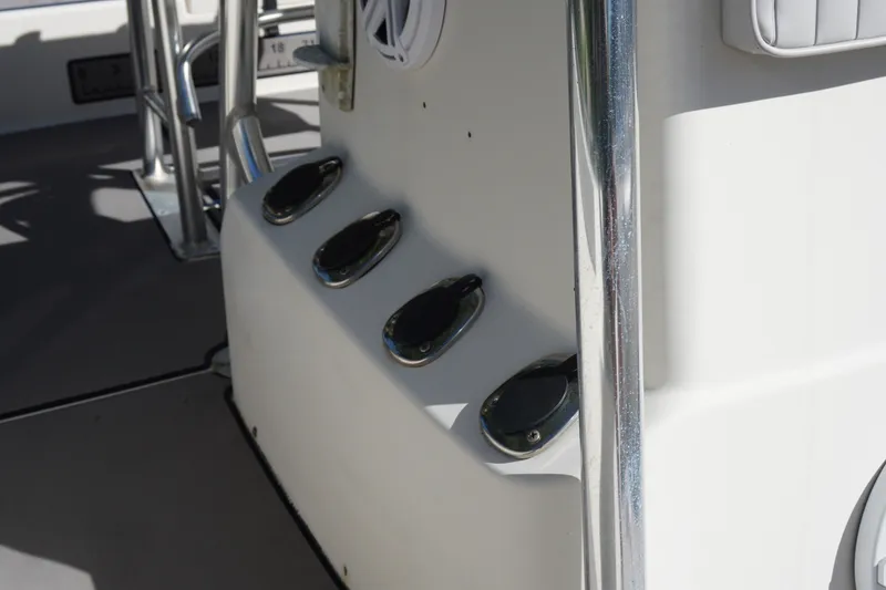 Slide: The Image of Close-up of a 2000 Pathfinder 2200 V boat's deck with rod holders. - 17