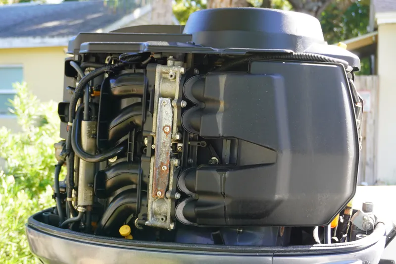 Slide: The Image of Close-up of a 2000 Pathfinder 2200 V boat engine, showcasing intricate mechanical details. - 5