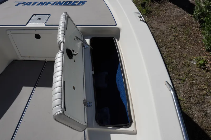 Slide: The Image of Open storage compartment on a 2000 Pathfinder 2200 V boat deck. - 14