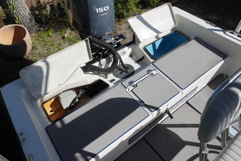Slide: The Image of Pathfinder 2200 V boat interior with Yamaha 150 engine, open storage compartments. - 8