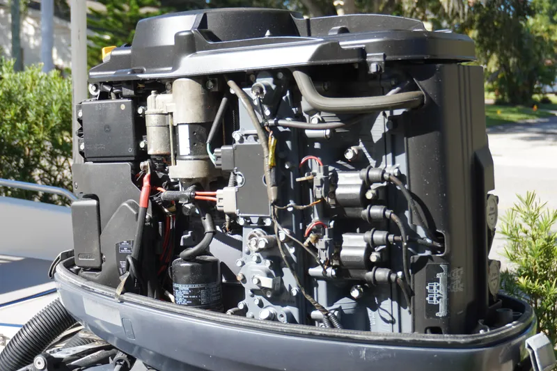 Slide: The Image of Open engine of a 2000 Pathfinder 2200 V boat, showcasing intricate mechanical components. - 4
